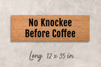 a rectangular brown door mat with the text "No Knockee Before Coffee" printed on it.