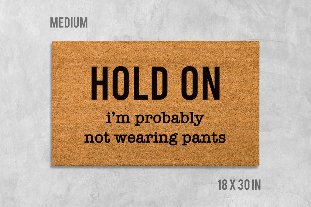 Funny Door Mat: 'Hold On We're Not Wearing Pants' (Housewarming Gift)