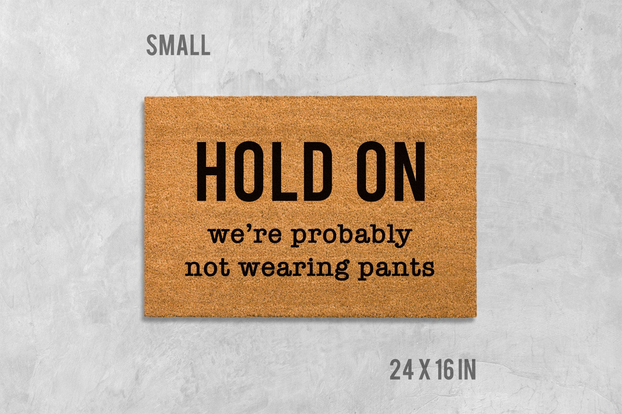 Funny Door Mat: 'Hold On We're Not Wearing Pants' (Housewarming Gift)