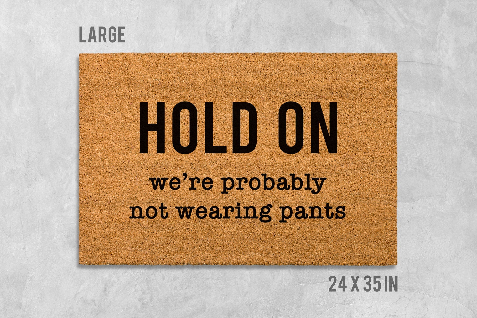 Funny Door Mat: 'Hold On We're Not Wearing Pants' (Housewarming Gift)